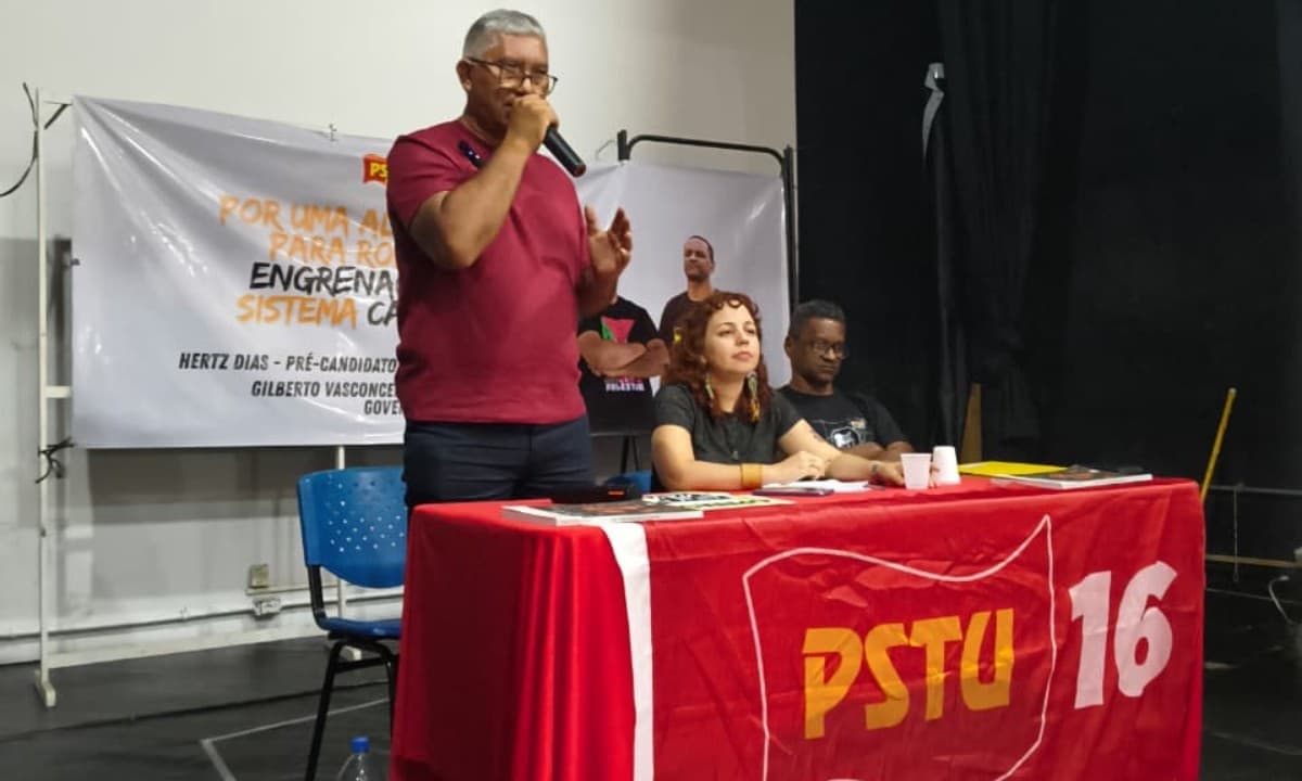 Banner de campanha do PSTU exibe fotos de Gilberto Vasconcelos e Juliana Frota com fundo vermelho e estrela amarela.