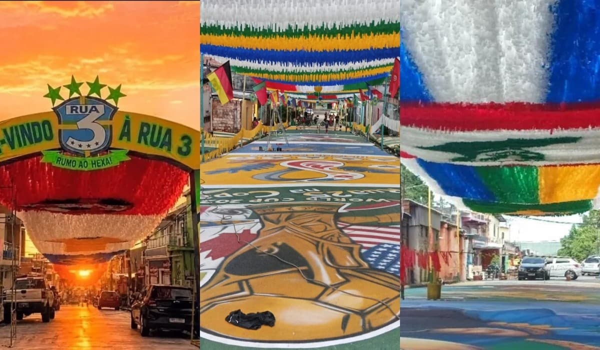 Fachada de casa decorada com bandeiras do Brasil e bandeirinhas coloridas em rua do bairro Morro da Liberdade.
